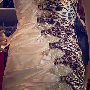 Formal white dress with leopard accents.